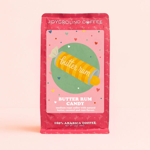 Butter Rum Candy flavor Joyground Coffee bag featuring a yellow roll of butter rum candies.
