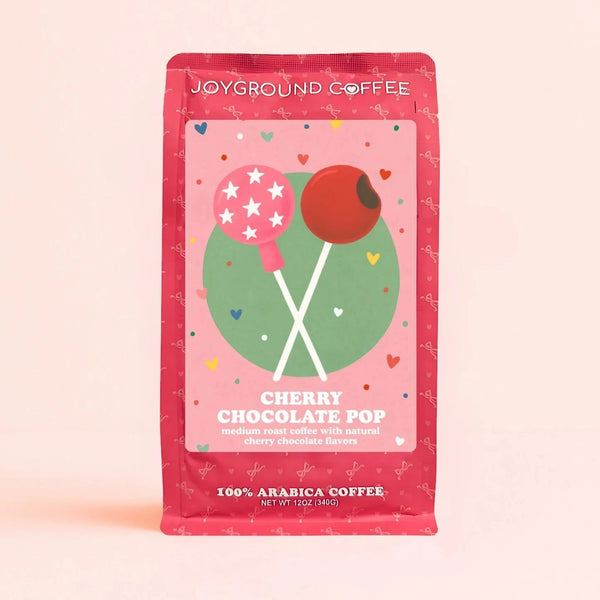 Chocolate Cherry Pop Joyground Coffee bag on a pink background