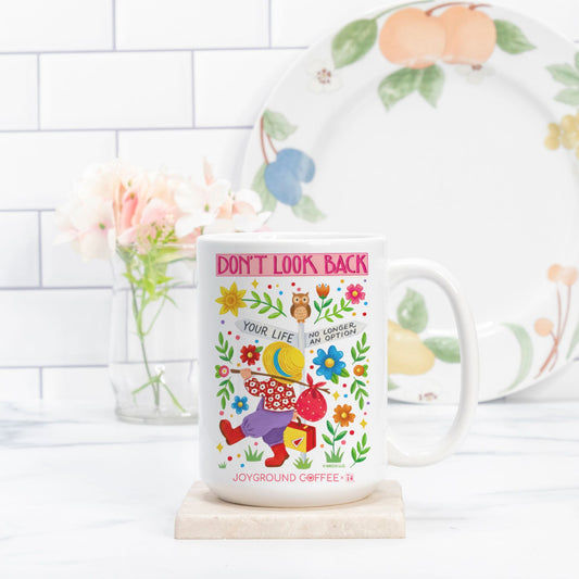 Mary Engelbreit Don't Look Back white ceramic mug from Joyground Coffee