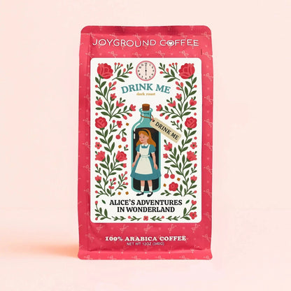 Alice in Wonderland Drink Me Dark Roast themed pink coffee bag