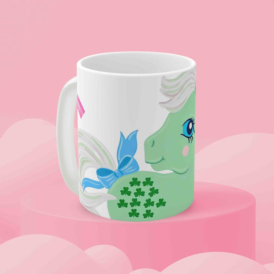 Joyground Coffee My Little Pony G1 Minty coffee mug in a pink cloud background.