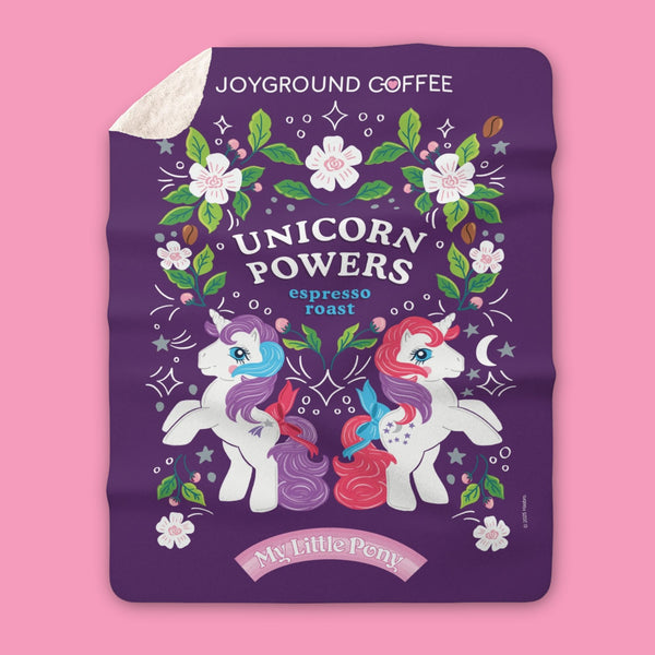 My Little Pony blanket featuring MLPG1 Glory and Moondancer from Joyground Coffee on pink background.