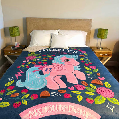 Queen bed with a My Little Pony-themed blanket featuring Firefly from MLP G1.