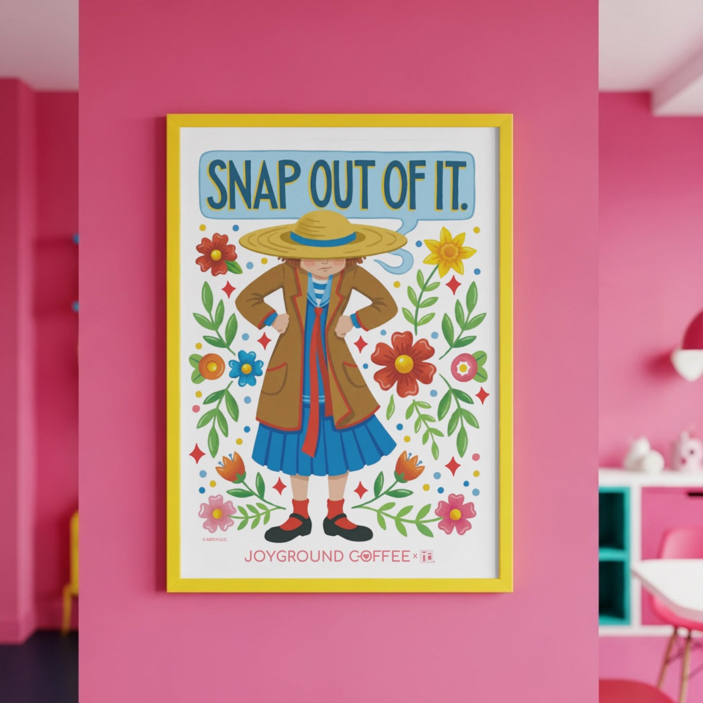 Framed artwork with a Mary Engelbreit character and floral design on a pink wall, featuring the text Snap Out of It and Joyground Coffee.